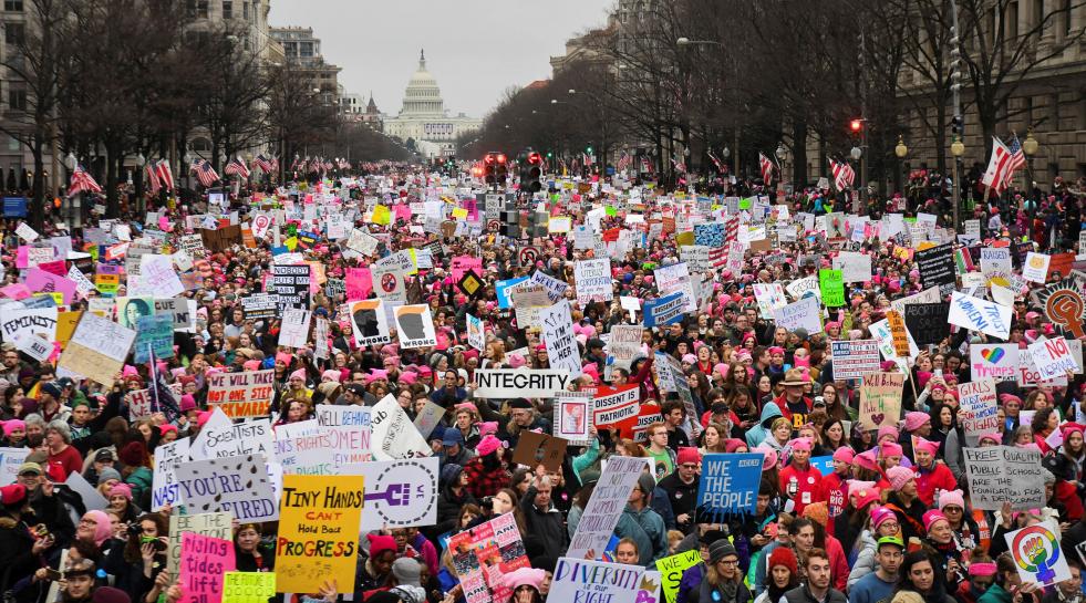 Hundreds of thousands march down Pennsylvania Avenue during the Women's March. REUTERS/Bryan Woolston